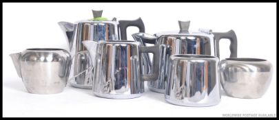 A retro 1960's stainless steel tea service consisting of teapot, water pot, creamer, sugar bowl etc.