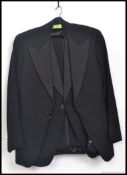 A  gentlemans mid century morning suit comprising top and trousers with a secondary suit top.
