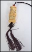 A carved bone 20th century Chinese oriental inro. Carved with detail of animals to front.