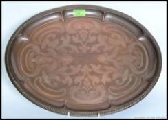 A late Victorian Arts & Crafts oval copper tray by Joseph Sankie & Sons.