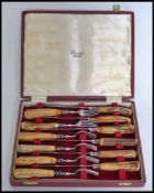 A good quality Harrods of London  cased set of fish knives in original presentation box