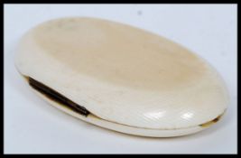 A 19th century ivory cased sewing set, the ivory case of lozenge form being, monogrammed to the lid.