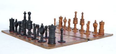 A finely carved 20th century boxwood  and ebony chess set in the manner of William Lund with