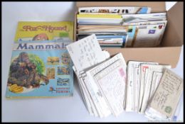 A collection of postcards 117 UK with stamps, 118 foreign with stamps and 350 plus unused,