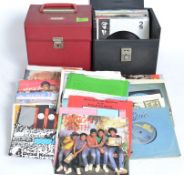 A fantastic mix of 45 rpm vinyl singles in two carry cases dating from the late 1970's to include