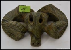 An unusual soapstone / agate carving of a rams head