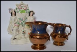 An antique Staffordshire flatback figurine (slight damage to top),