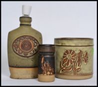 A collection of Tremar Cornish studio pottery to include a lamp base, planter and a small vase.