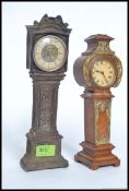 Two vintage 20th century miniature grandfather clocks, both having roman numerals to the face.
