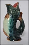 A 19th century Majolica fish pitcher jug - gurgle. Unmarked to base retaining vibrant colours.
