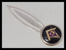 A silver ( stamped 925 ) and white metal enamel topped bookmark with masonic emblem.