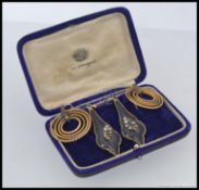 A pair of Victorian ladies mourning earrings having Forget-me-not flowers with inset stones.