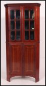 A 19th century mahogany inlaid corner cabinet.