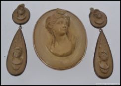 A large silver mounted cameo in relief of a maiden together with a pair of matching clip on drop