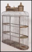 A mid 20th century vintage three tier bird cage of architectural form,