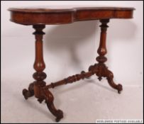 A good quality Victorian burr walnut kidney shaped writing table.