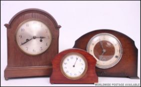 An oak cased bracket clock with 8 day movement striking on a chime together with a mahogany cased