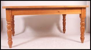 A very large contemporary country style pine dining table.