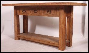 A fabulous contemporary chunky pine kitchen table / scullery table  being raised on squared legs