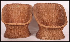 A near pair of retro whicker peacock style bedroom chairs. each with circular seats.
