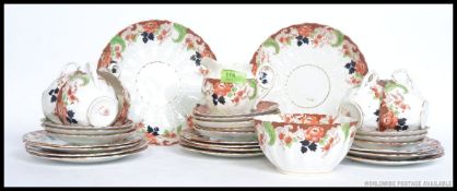 A late 19th early 20th century Staffordshire tea service in a Imari pattern to consist of cups,