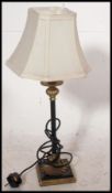 A good quality pair of Neo-Classical table lamps having shades over shaped bases being wired.