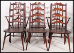 A set of six mid century Ercol elm bar back and spindle dining chairs in the Gothic style,