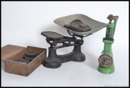 A vintage set of balance scales along with weights and a vintage enamel mincer