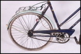 A vintage 1960's ladies Triumph Palm Beech bicycle with original paintwork, saddle etc.