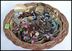 A basket of costume jewellery to include bracelets and bangles,