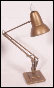 A good early 20th century Herbert Terry gilt finish industrial anglepoise lamp on square terraced