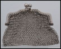 A silver hallmarked ladies sovereign mesh purse with chain. Birmingham hallmarks for 1915.