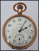 A good quality gold plated CYMA open faced pocket watch complete with the original leather