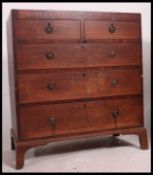 A 19th century Georgian oak and mahogany inlaid chest of drawers having 2 short over 3 deep drawers