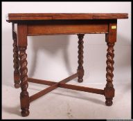 A 1920's good solid oak barleytwist draw leaf refectory dining table.