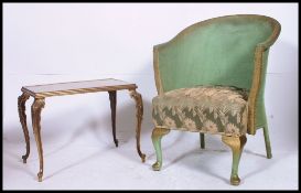 A 1950's rococo gilt metal side table together with a Lloyd Loom style bedroom chair with padded
