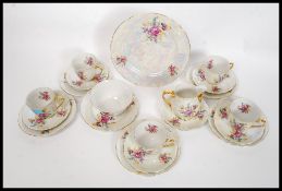 A 20th century Czech lusterware tea service to include cups,