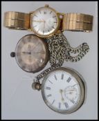 A silver metal cased pocket watch stamped to the movement Moulinie Geneve along with another silver