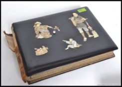 A JAPANESE BONE INLAID AND LACQUERED POSTCARD ALBUM with watercolour scenes within,