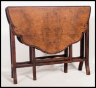 A Victorian walnut Sutherland table.