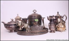 A collection of silver plated wares to include ice bucket, teapots, sugar sifter, creamers, ashtray,