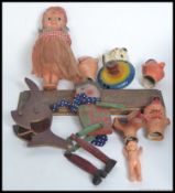 A collection of earlier 20th century and later dolls house furniture along with several glove