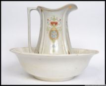 An early 20th century Art Nouveau ceramic washbowl and water jug by JG Meakin being stamped to the