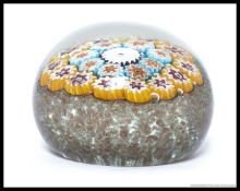 A vintage glass millifiori paperweight, no makers mark.