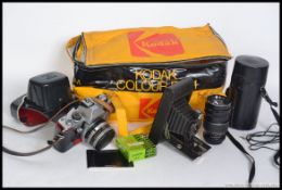 A collection of vintage cameras to include 35mm such as Praktica,