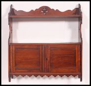 A Victorian mahogany hanging cabinet.