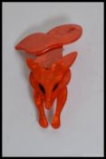 A retro mid century lucite and plastic ladies brooch in the form of a fox having pin to back.
