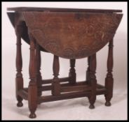A 19th century oak gate leg drop leaf dining / occasional table.