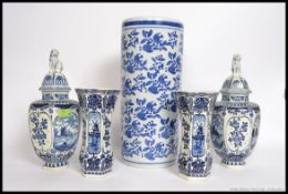 A collection of Delft blue and white ceramics to include vases and lidded vases by Royal Sphinx.