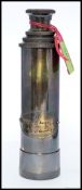 An antique style military brass four draw telescope, with banding to lens piece.
